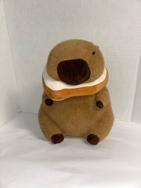 Plush Brown Capybara Pet Toy with Orange-and-White Donut Collar